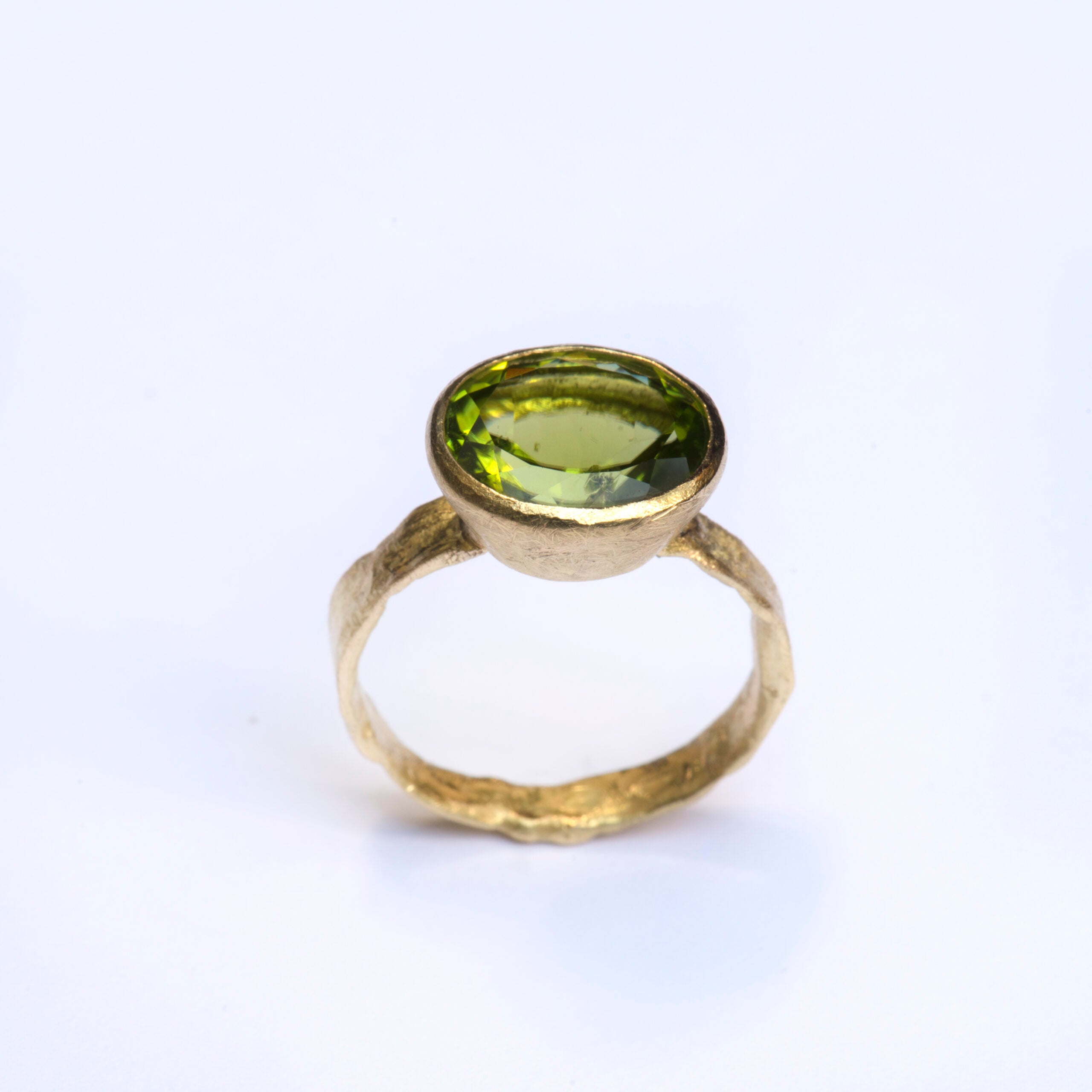 Oval Peridot gold ring by Disa Allsopp