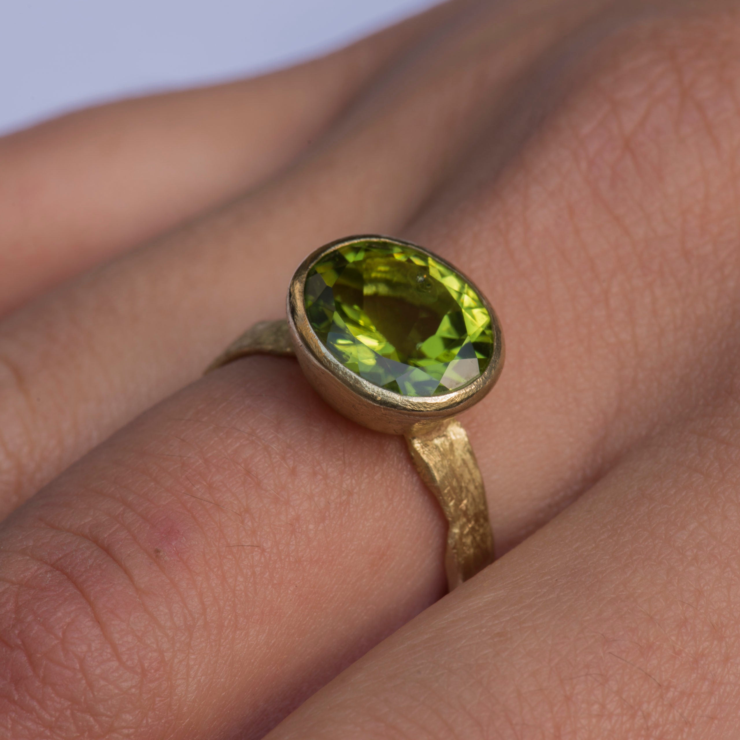 Oval Peridot gold ring by Disa Allsopp